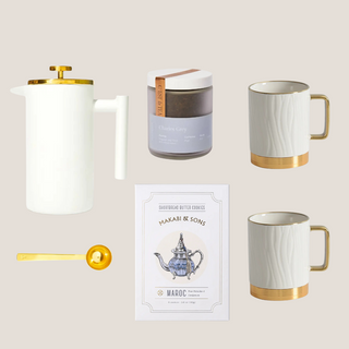 Luxe Tea Indulgence Gift Box with White with Gold Trim French Press/ Tea Press, Two White Porcelain Mugs with Gold Trim and Gold Aluminum Non- Slip Base, Gold Tea Scoop, Choice of Charles Gray Or Green Gold Loose Leaf Tea, Makabi & Sons Shortbread Cookies, Packaged in a Matte White Gift Box and Tied with a Ribbon Bow, Luxury Gift Box, Luxury Gift Reno, Gift Company Reno