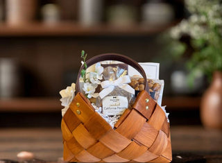Luxury woven gift basket with gourmet treats including candied California pecans and artisan snacks – elegant corporate gift basket idea for clients, teams, and professional gifting.