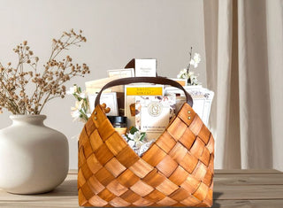 Luxury woven gift basket filled with gourmet snacks, artisan treats, and premium packaged foods – elegant curated gift basket for corporate gifting, client appreciation, and thoughtful celebrations.