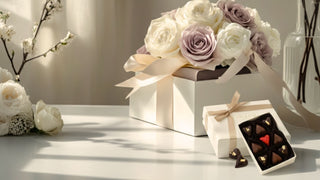 Luxury Valentine’s Day gift featuring an elegant ivory gift box with soft blush ribbon, refined floral arrangement, and gourmet chocolate truffle box styled in natural light for an elevated Valentine’s collection by Biggest Little Baskets