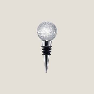 Product view of a 4.75-inch bottle stopper with clear dimpled glass golf ball topper, tapered polished metal base, and black silicone rings.