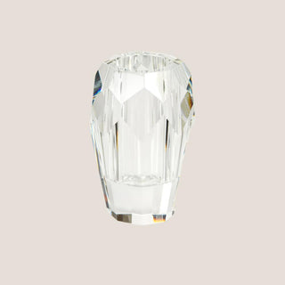 Front product view of a 5-inch clear cut crystal bud vase with deep geometric facets on a pale neutral background.