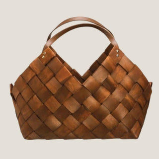 Empty signature brown woven wood gift basket with curved faux-leather handles, the reusable vessel used for large custom BLB gift designs.