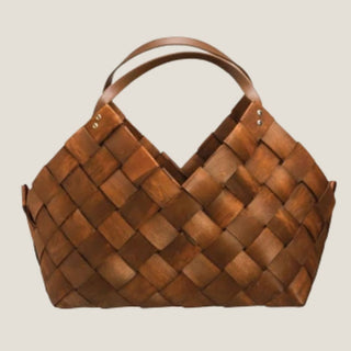 Brown woven gift basket with imitation leather handle - the signature biggest little baskets vessel for luxury custom and corporate gifting.
