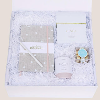 A beautifully curated Birthday Wishes Gift Box featuring a polka-dotted linen journal, a luxurious gold-accent pen, a wild rose bath truffle, birthday cake cookie bites, and a crisp white linen candle. Thoughtfully wrapped with a satin ribbon, this elegant gift box is perfect for celebrating birthdays in style.
Biggest Little Baskets, Reno Gift, Reno, Nevada Gift, Birthday Gift for Her, Birthday Gift, Gift Box, Luxury Gift Box for Her