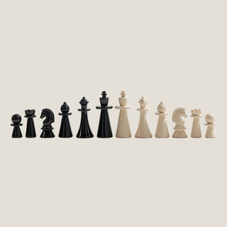 Black and ivory chess pieces included with the burl wood chess and checkers board gift set, shown against a clean background.