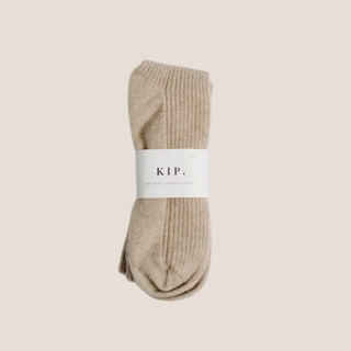 Champagne taupe 100% cashmere sleep socks in a one-size design for bedtime, travel, relaxation, or self-care gifting.