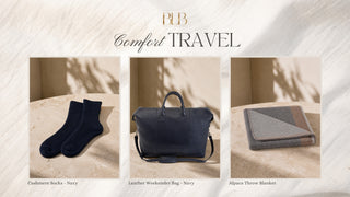 A travel-themed product collage under the heading 'BLB Comfort TRAVEL' showing three coordinated items: navy cashmere socks, a navy leather weekender bag, and a gray-and-beige throw blanket, each displayed on a beige surface with soft shadow overlays.