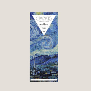 Compartés Starry Night salted-caramel dark chocolate bar in blue Van Gogh artwork packaging on a light neutral background.
