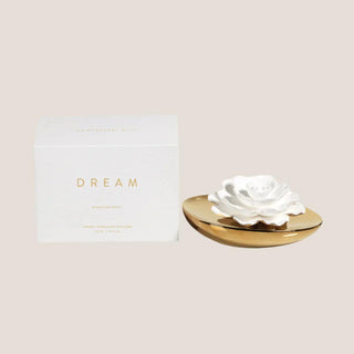 Dream Moroccan peony diffuser set with white presentation box, sculpted porcelain flower, and low gold ceramic fragrance vessel.