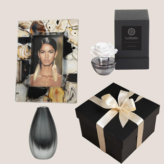 Elegant Noir gift collection with natural agate 4x6 frame, smoke glass bud vase, porcelain flower diffuser, and black keepsake box with ivory ribbon.