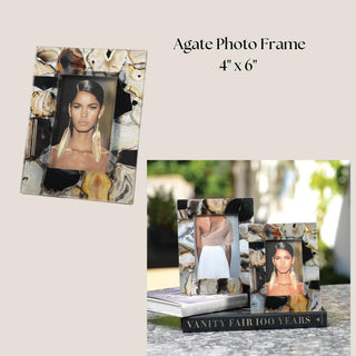 Natural agate 4x6 photo frame shown from the front and back, styled outdoors on a Vanity Fair book to display its varied black, cream, and brown stone.