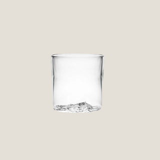 Isolated product view of the clear 8-ounce Lake Tahoe tumbler showing the dimensional topographic glass relief formed in its base.