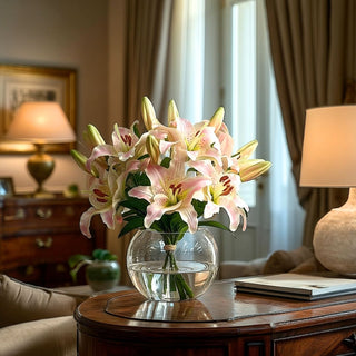 Light pink Casablanca lily faux floral arrangement styled on an elegant wood entryway table with soft natural light, featuring realistic faux water and a quiet luxury look ideal for refined spring home décor.