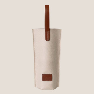 Merino Wool Bottle Bag with leather handle and leather patch detail in Feather Sienna, designed for wine, champagne, olive oil, host gifts, and curated gifting.