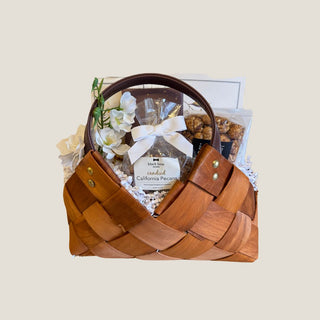 Petite Treat Gift Basket with woven wood , vegan leather handles, filled with gourmet cookies, candied pecans, and savory snacks. a perfect gift for gift giving in Reno. Nevada or to ship nationwide. 
