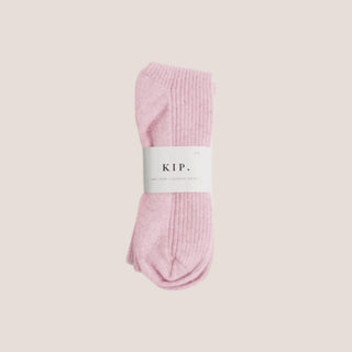 Pink 100% cashmere sleep socks in a one-size design for birthdays, self-care gifts, relaxation, or a thoughtful comfort gesture.