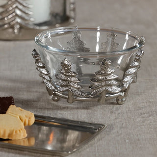 “Silver and glass Christmas tree bowl styled on linen table with cookies and silver tray – festive tabletop decor.”
