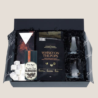A premium gift box titled "Sip & Savor Sidekicks," featuring curated treats including gourmet whiskey-infused caramel popcorn, artisan dark chocolate, chocolate-coated almonds, whiskey glasses, and reusable whiskey stones. Perfect for men who enjoy sophisticated indulgence and crafted for occasions like celebrations or relaxing moments. Ideal for gifting in Reno and beyond. Gift box for men, Whiskey gift box, Gourmet treats for men, Whiskey stones and glasses
Gifts for men Reno, Luxury gift box Reno