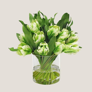 Two-tone green tulip faux floral arrangement in a clear glass vase with realistic faux water, an elegant long-lasting floral gift suitable for any occasion.