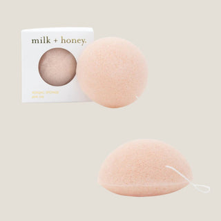 Two pink sponges with a 'milk + honey' box on a beige background