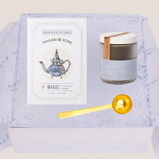 Open Petite Tea Indulgence Gift Box with Charles Grey tea, shortbread cookies, and gold tea scoop in white gift fill.
