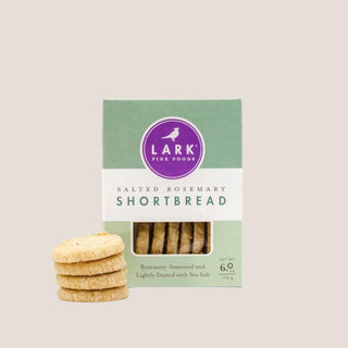 Lark salted rosemary shortbread cookies in a green package with several cookies displayed in front.