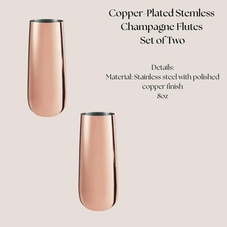 Set of two polished copper-plated stainless-steel stemless champagne flutes on a neutral background.