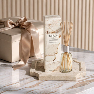 Welcome Home New Home Gift Box Level 1 with Sea Salt and Vanilla diffuser and small travertine tray, styled as a ready-to-gift housewarming or closing gift.